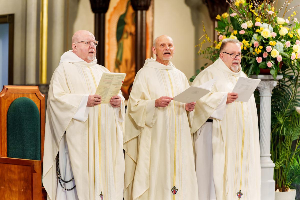 Father Stan with two other Dominican priests, singing
